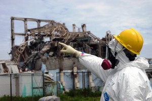 IAEA fact-finding team leader Mike Weightman examines Reactor Unit 3 at the Fukushima Daiichi Nuclear Power Plant.